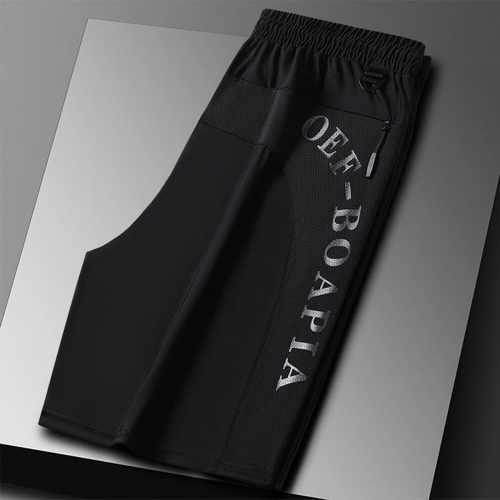 "Herrens sommar stretchiga sportshorts i grått, elastisk midja, praktiska fickor, perfekt för träning och fritid."