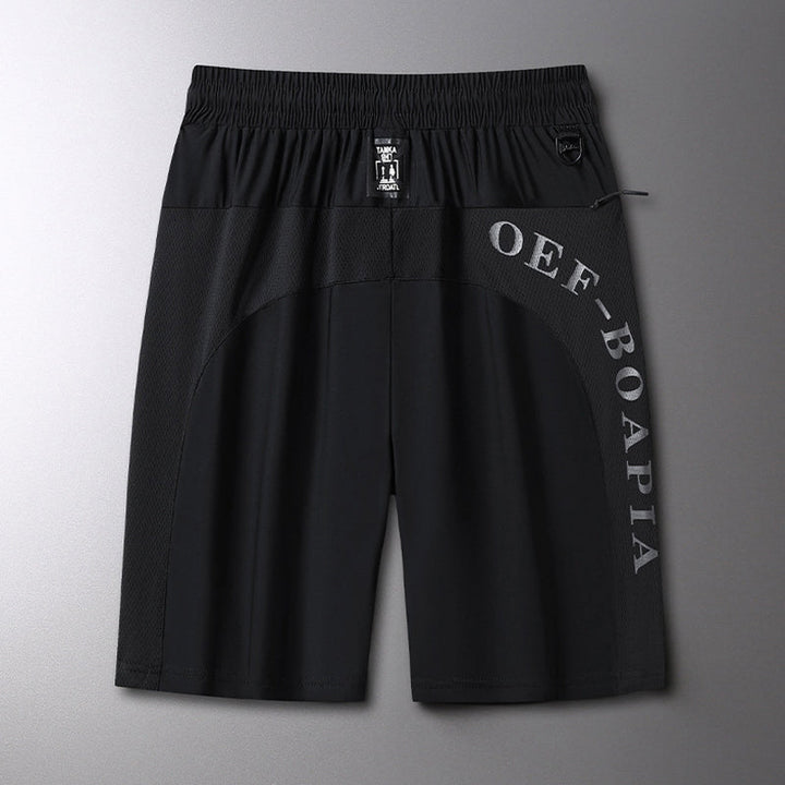 "Herrens sommar stretchiga sportshorts i grått, elastisk midja, praktiska fickor, perfekt för träning och fritid."