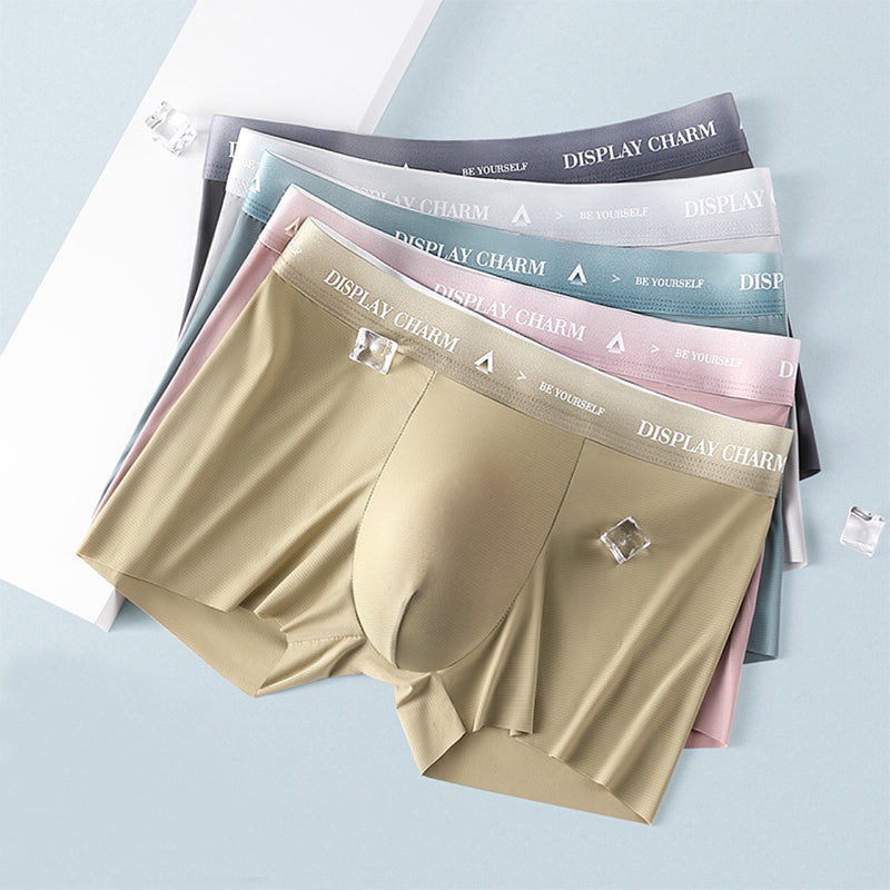 "Herrunderkläder av silke, boxers i mörkgrått, silvergrått och senapsgult med elastiskt midjeband, mjuka sömmar."