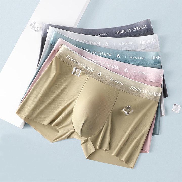 "Herrunderkläder av silke, boxers i mörkgrått, silvergrått och senapsgult med elastiskt midjeband, mjuka sömmar."