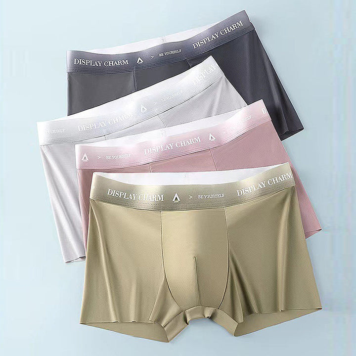 "Herrunderkläder av silke, boxers i mörkgrått, silvergrått och senapsgult med elastiskt midjeband, mjuka sömmar."