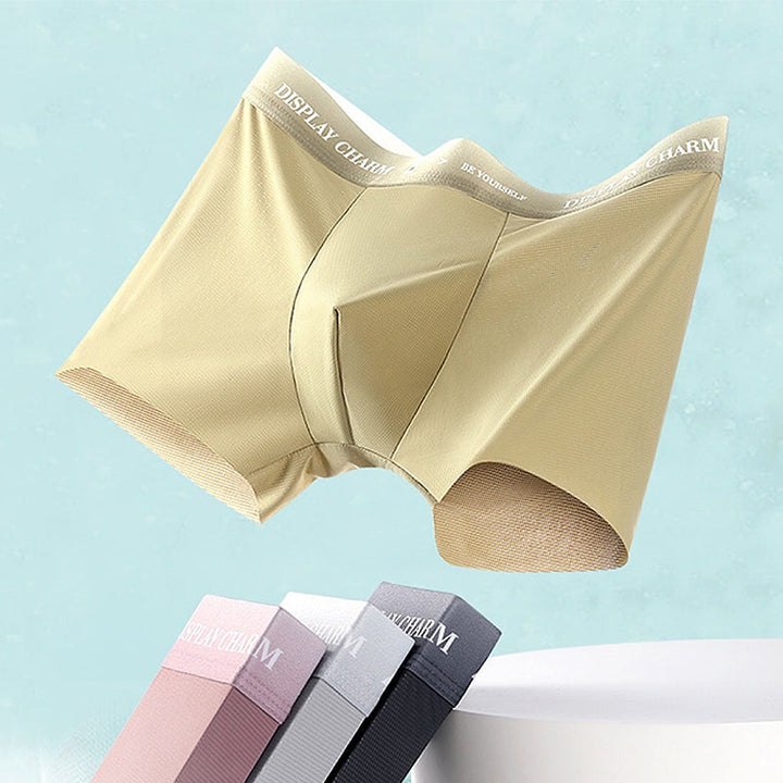 "Herrunderkläder av silke, boxers i mörkgrått, silvergrått och senapsgult med elastiskt midjeband, mjuka sömmar."