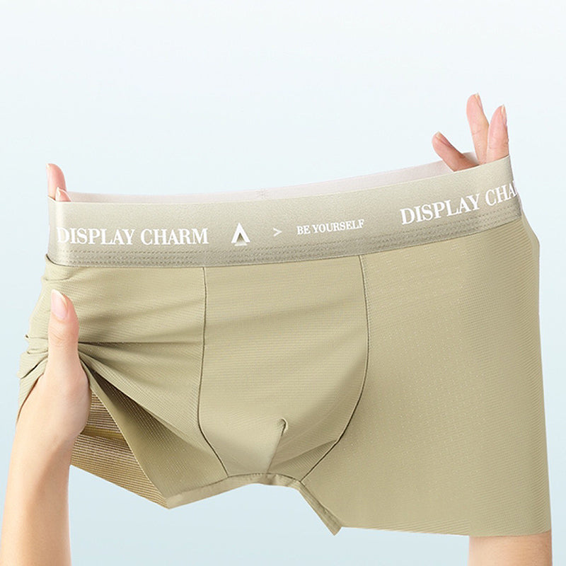 "Herrunderkläder av silke, boxers i mörkgrått, silvergrått och senapsgult med elastiskt midjeband, mjuka sömmar."