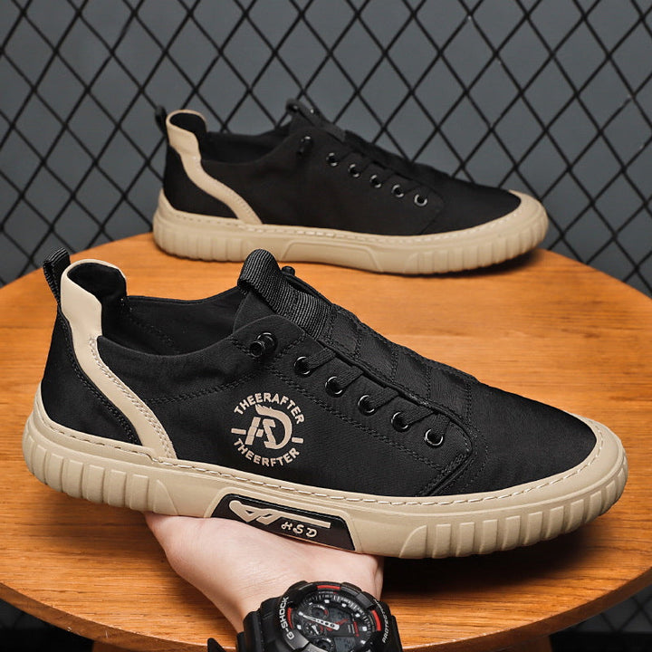 "Högklassiga herrsneakers i grått med elastiska snören och antihalksula, perfekt för stil och komfort."