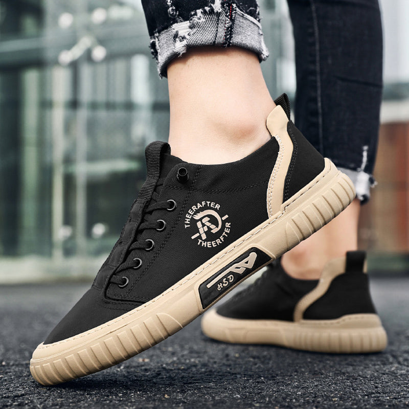 "Högklassiga herrsneakers i grått med elastiska snören och antihalksula, perfekt för stil och komfort."