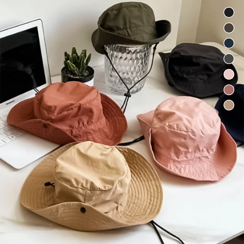"Hopfällbar solhatt för damer med UV-skydd, bred brätte i vattentät polyester, trendig och enkel att bära."