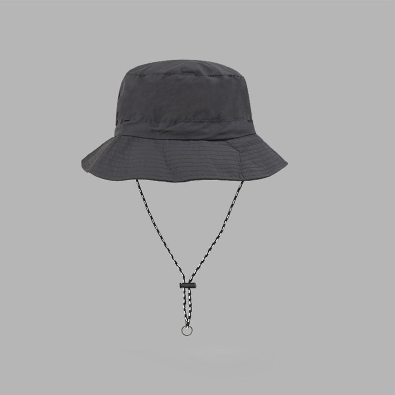 "Hopfällbar solhatt för damer med UV-skydd, bred brätte i vattentät polyester, trendig och enkel att bära."