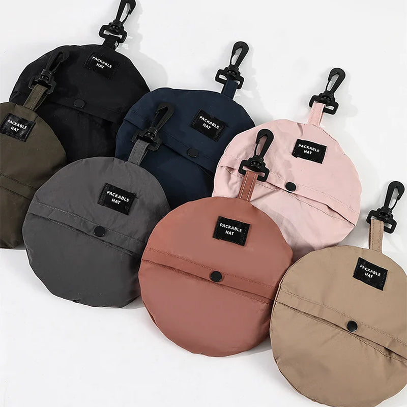"Hopfällbar solhatt för damer med UV-skydd, bred brätte i vattentät polyester, trendig och enkel att bära."