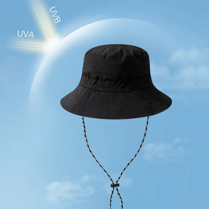 "Hopfällbar solhatt för damer med UV-skydd, bred brätte i vattentät polyester, trendig och enkel att bära."