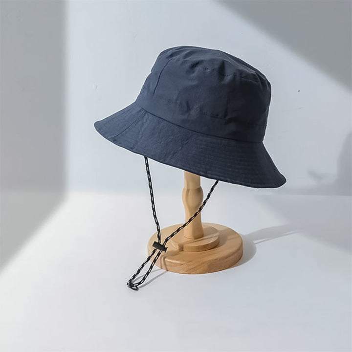 "Hopfällbar solhatt för damer med UV-skydd, bred brätte i vattentät polyester, trendig och enkel att bära."