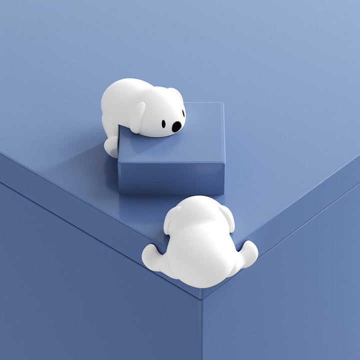 "Hörnskydd i silikon, tecknad design, rosa ton, skyddar barn från skarpa hörn, perfekt för soffbord och stolar."