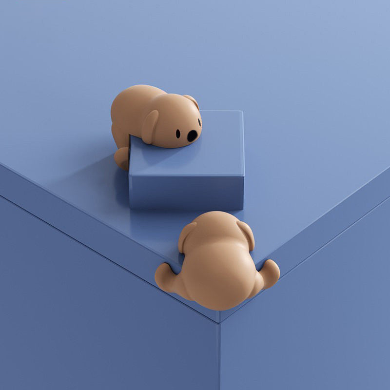 "Hörnskydd i silikon, tecknad design, rosa ton, skyddar barn från skarpa hörn, perfekt för soffbord och stolar."