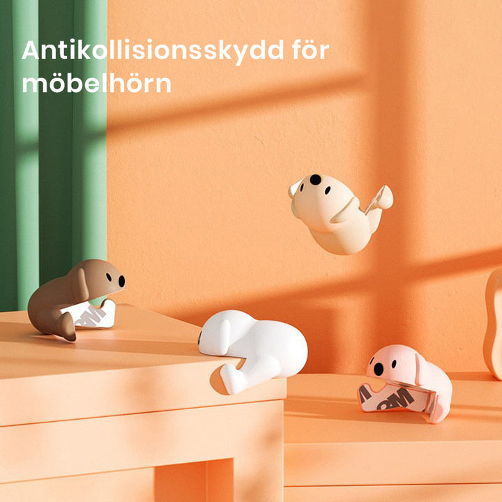 "Hörnskydd i silikon, tecknad design, rosa ton, skyddar barn från skarpa hörn, perfekt för soffbord och stolar."