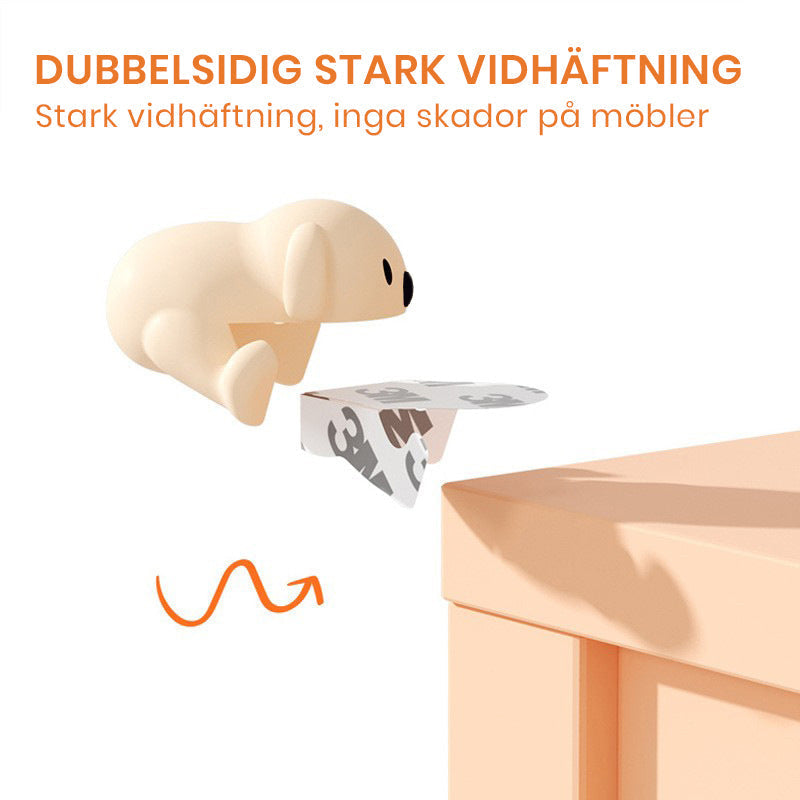 "Hörnskydd i silikon, tecknad design, rosa ton, skyddar barn från skarpa hörn, perfekt för soffbord och stolar."