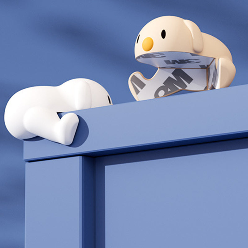 "Hörnskydd i silikon, tecknad design, rosa ton, skyddar barn från skarpa hörn, perfekt för soffbord och stolar."