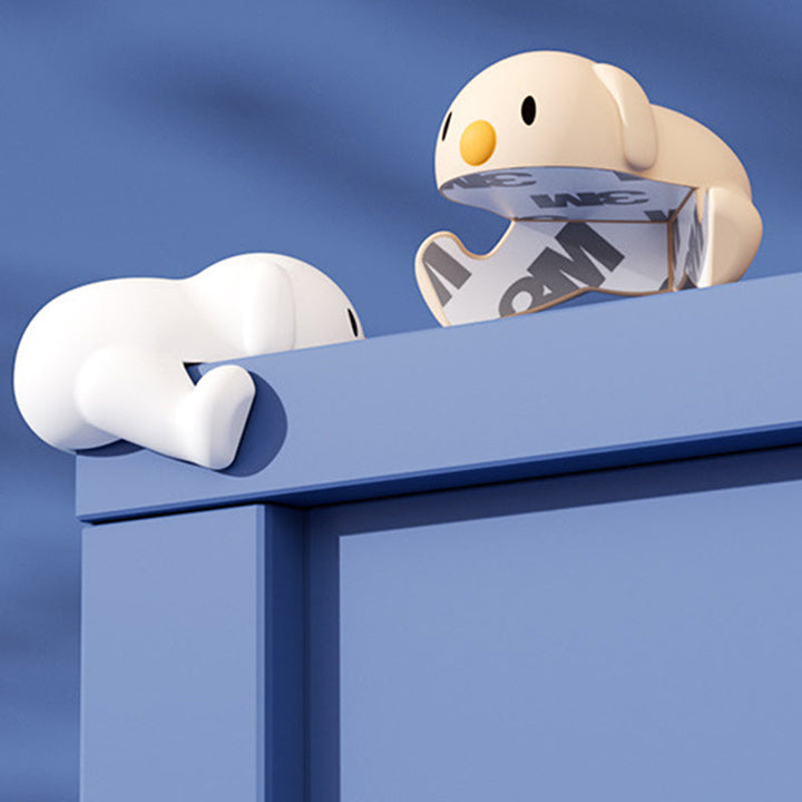 "Hörnskydd i silikon, tecknad design, rosa ton, skyddar barn från skarpa hörn, perfekt för soffbord och stolar."