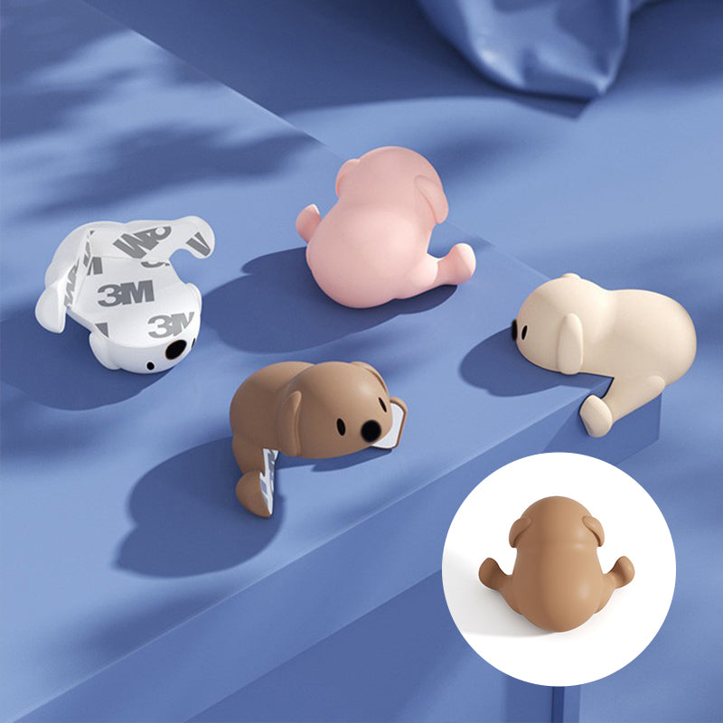 "Hörnskydd i silikon, tecknad design, rosa ton, skyddar barn från skarpa hörn, perfekt för soffbord och stolar."