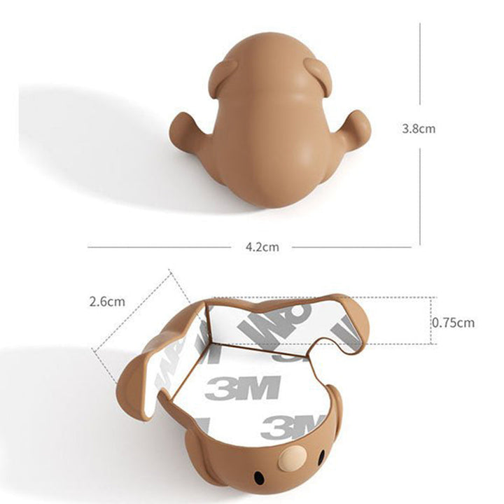 "Hörnskydd i silikon, tecknad design, rosa ton, skyddar barn från skarpa hörn, perfekt för soffbord och stolar."