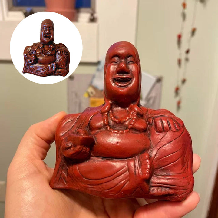Humoristisk Buddha figur med utsträckt långfinger, gjord av harts, perfekt för skrivbord eller hylla, väcker skratt.