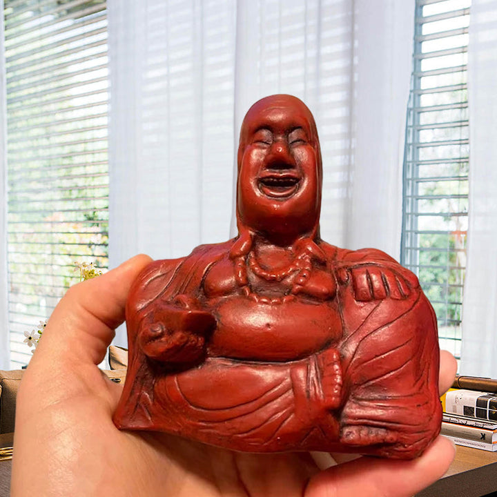Humoristisk Buddha figur med utsträckt långfinger, gjord av harts, perfekt för skrivbord eller hylla, väcker skratt.