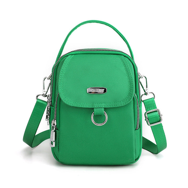 "Lätt vattentät unisex crossbody-väska i nylon med flera fickor, justerbar axelrem, kompakt och funktionell design"