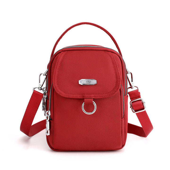 "Lätt vattentät unisex crossbody-väska i nylon med flera fickor, justerbar axelrem, kompakt och funktionell design"