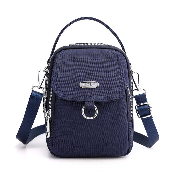 "Lätt vattentät unisex crossbody-väska i nylon med flera fickor, justerbar axelrem, kompakt och funktionell design"
