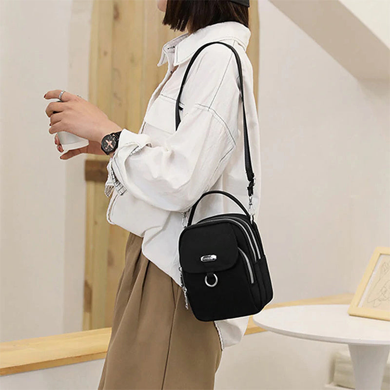 "Lätt vattentät unisex crossbody-väska i nylon med flera fickor, justerbar axelrem, kompakt och funktionell design"