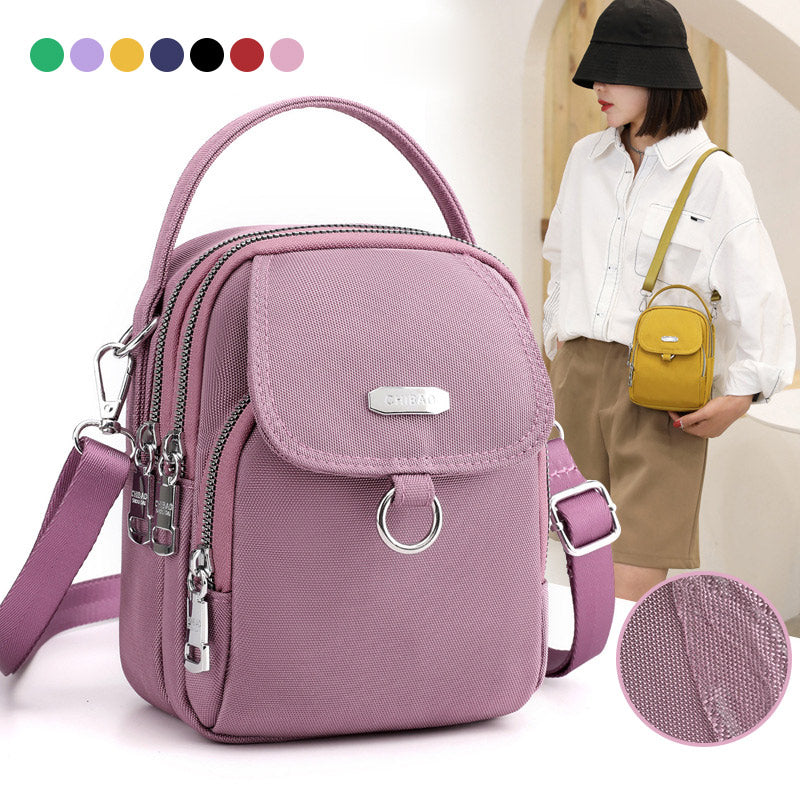 "Lätt vattentät unisex crossbody-väska i nylon med flera fickor, justerbar axelrem, kompakt och funktionell design"