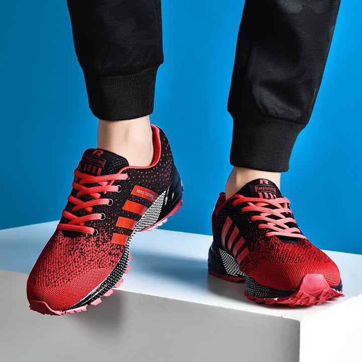 "Löparskor för män i mesh, livliga färgaccenter, halkfri sula, perfekt för jogging och sportaktiviteter."