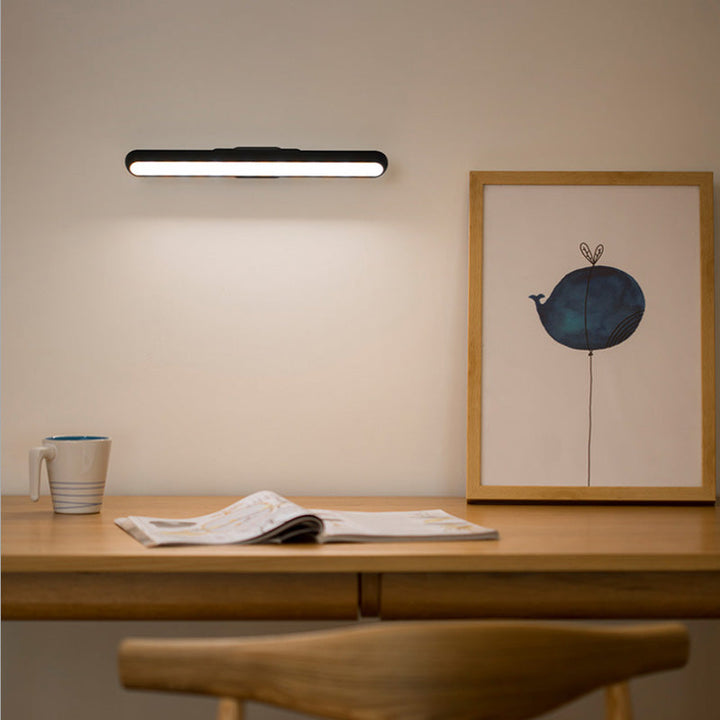 "Magnetisk läslampa med flexibel svanhals i aluminium, USB-laddning, justerbar vinkel och tre ljusstyrkenivåer."