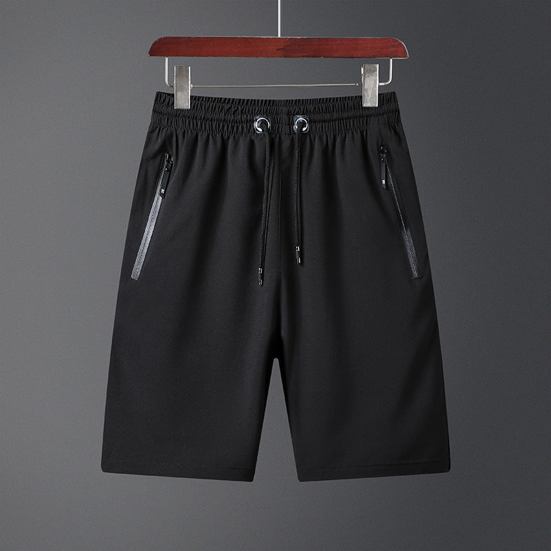 "Mäns snabbtorkande lätta träningsshorts i svart, grå och mörkblå. Elastisk midjeband och säker dragkedjeficka."