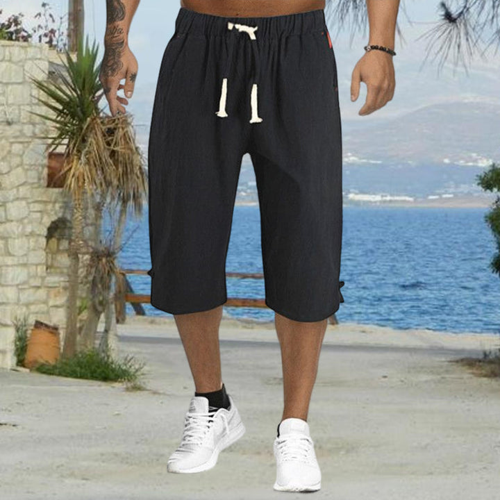 "Mäns sommar linnebyxor med dragsko, sidofickor, i lös haremstil, ljusbeige bomullslinne för vardag och strand."