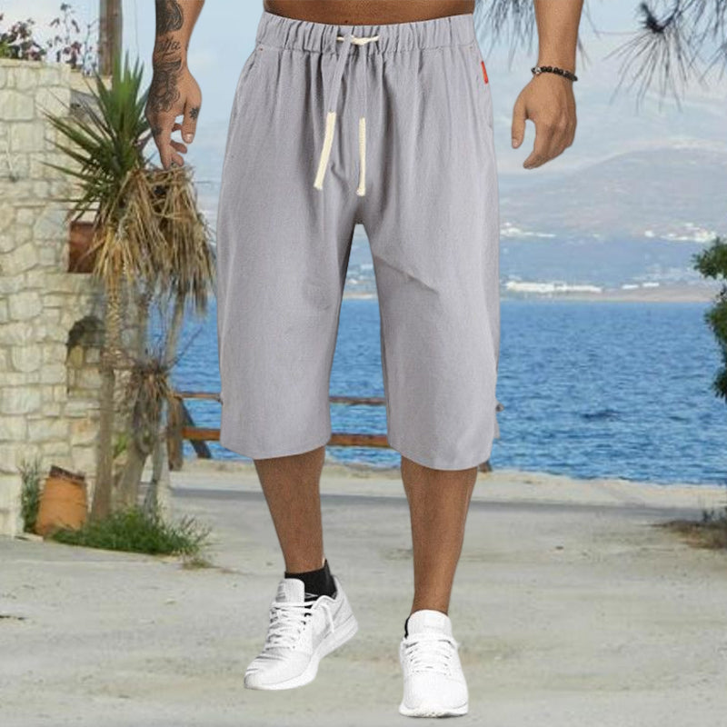 "Mäns sommar linnebyxor med dragsko, sidofickor, i lös haremstil, ljusbeige bomullslinne för vardag och strand."