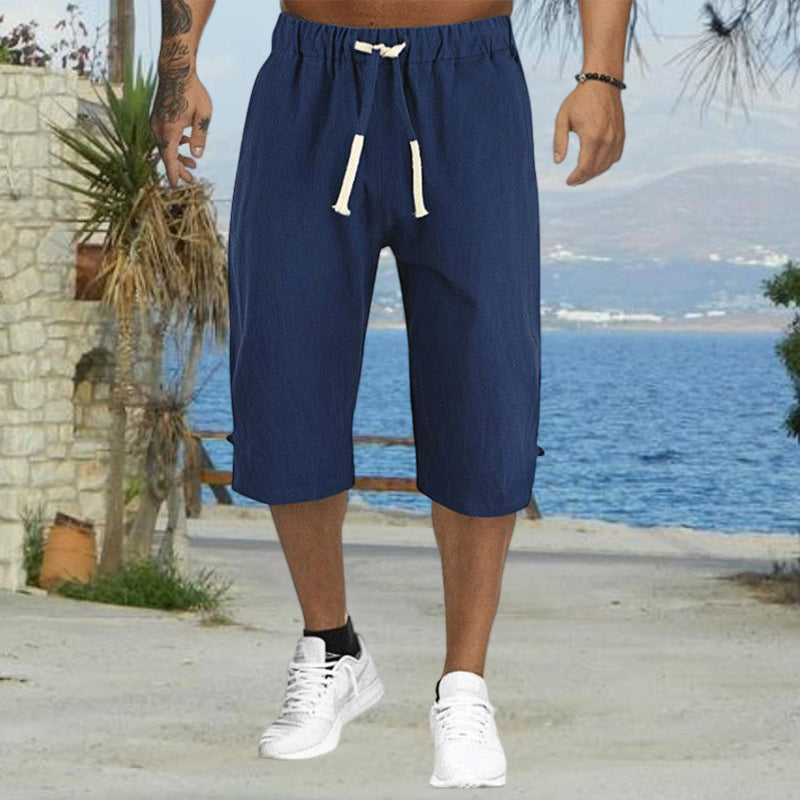 "Mäns sommar linnebyxor med dragsko, sidofickor, i lös haremstil, ljusbeige bomullslinne för vardag och strand."