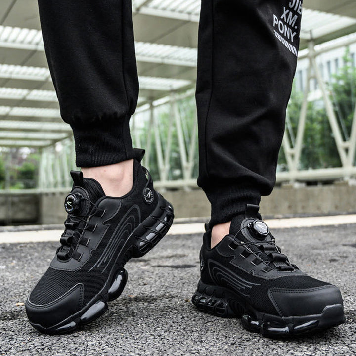 "Mäns svart säkerhetssko med ståltå och roterande knapp, tålig sula, idealisk för industrimiljö, erbjuder komfort och skydd."