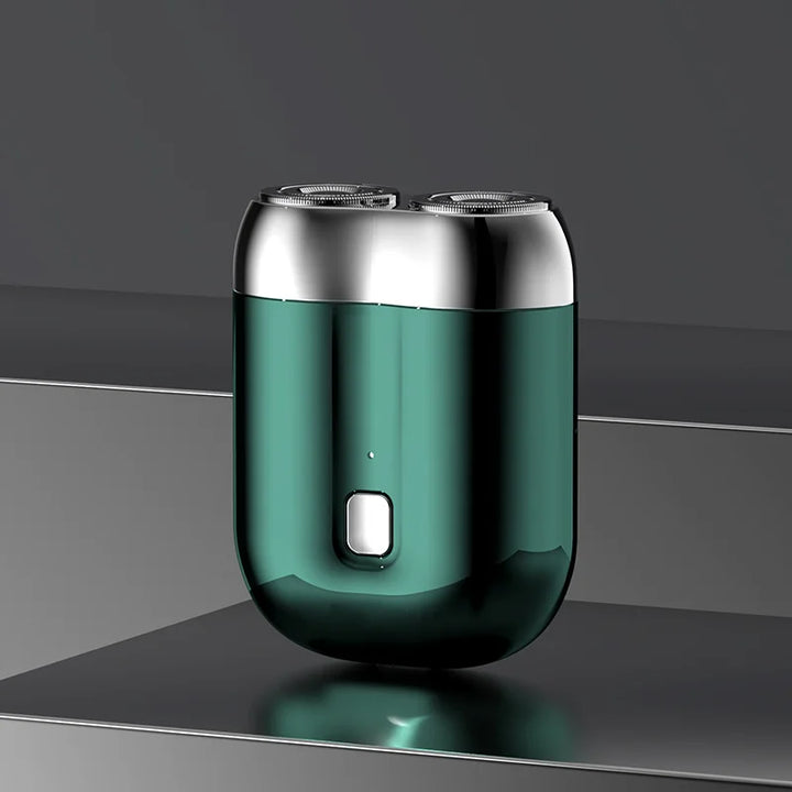 "Mini elektrisk rakapparat för män, bärbar, vattentät, kompakt design med rostfria stålblad och elegant finish."