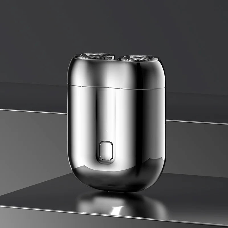 "Mini elektrisk rakapparat för män, bärbar, vattentät, kompakt design med rostfria stålblad och elegant finish."