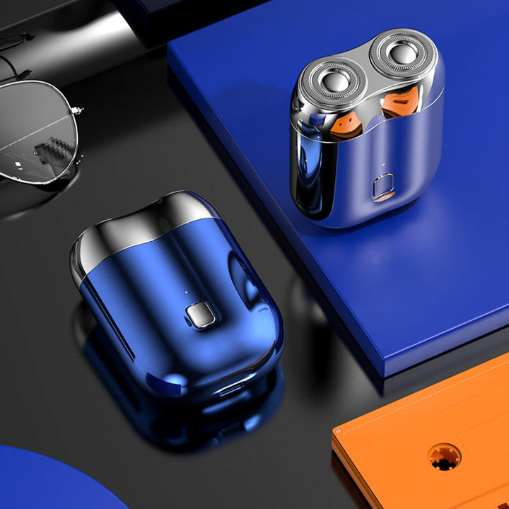 "Mini elektrisk rakapparat för män, bärbar, vattentät, kompakt design med rostfria stålblad och elegant finish."