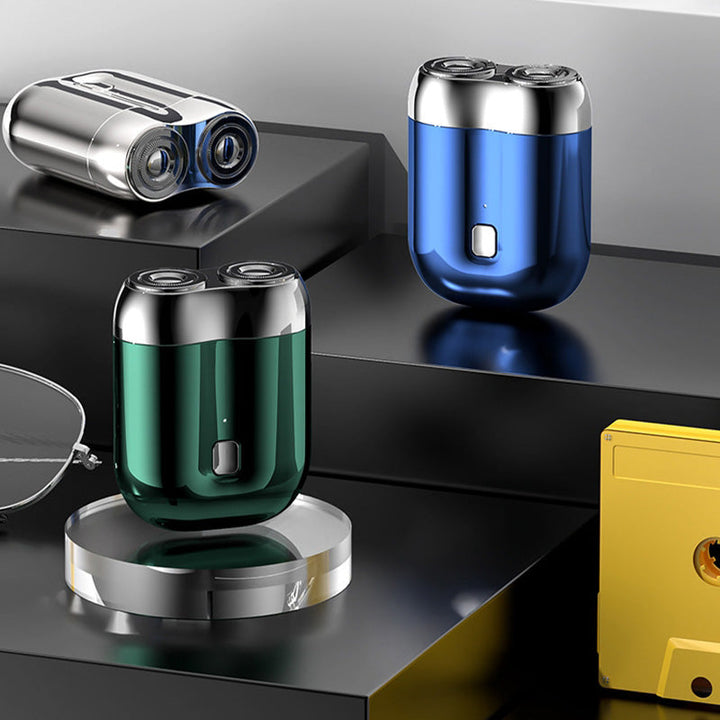 "Mini elektrisk rakapparat för män, bärbar, vattentät, kompakt design med rostfria stålblad och elegant finish."