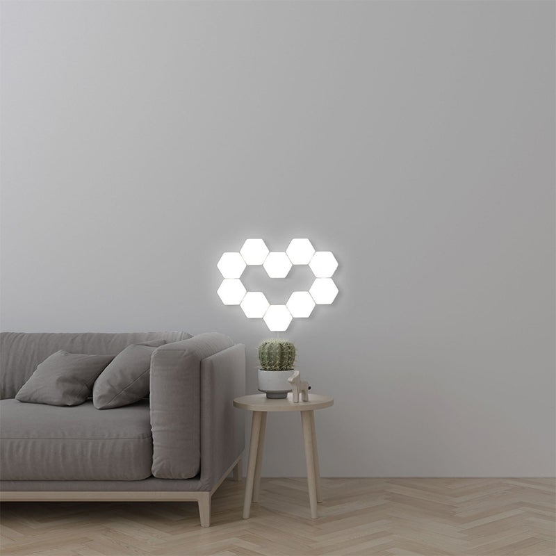 "Modern sexkantig LED-vägglampa med geometrisk design och touch-kontroll, belysning i ABS-material för elegant inredning."