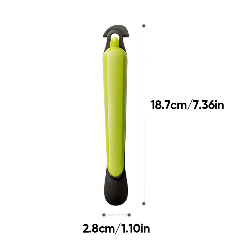 "Multifunktionellt fruktskalningsverktyg i grönt, hållbart material, perfekt för att enkelt skala frukt i köket."