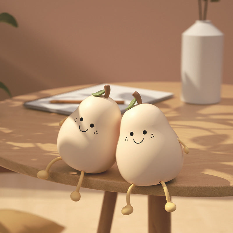 "Päronformad barnsäker nattlampa med justerbart ljus, gul och lekfull design, perfekt för barns rum."