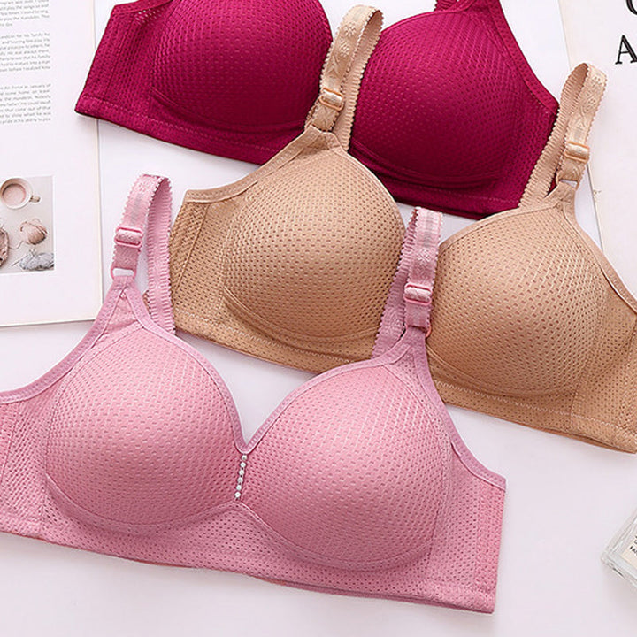 "Plus size bekväm trådlös bh för kvinnor med justerbart band, sömlös design i beige med elastiskt, justerbart band."