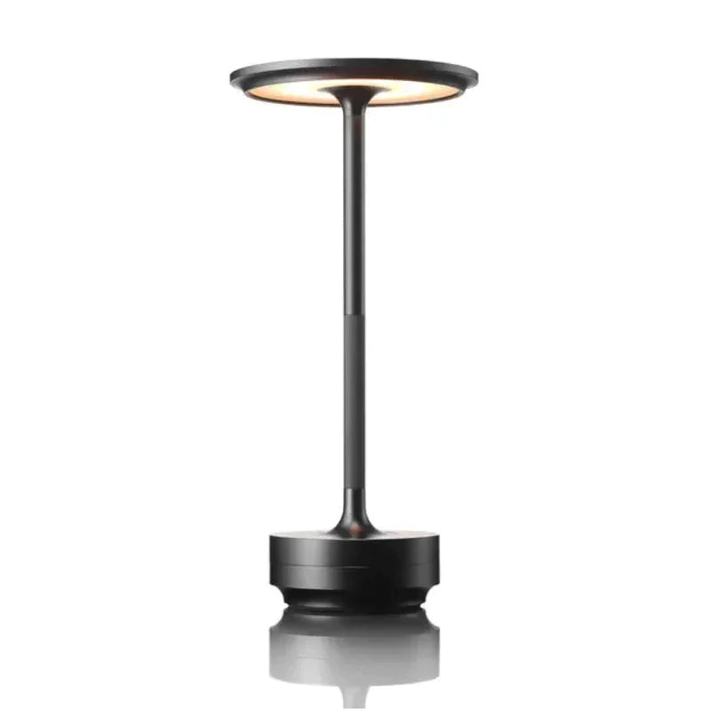 Portabel, elegant bordslampa med batteridrift. Modern design, mjukt ljus. Perfekt för hemmet.