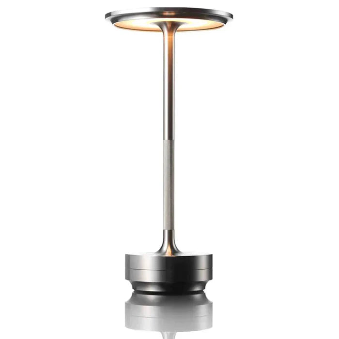 Portabel, elegant bordslampa med batteridrift. Modern design, mjukt ljus. Perfekt för hemmet.