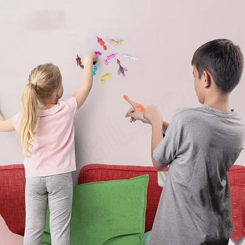"Set om 10 fingerleksaker med dinosaurieslungor i färgglada mönster, perfekt för barn att leka och lära sig om dinosaurier."