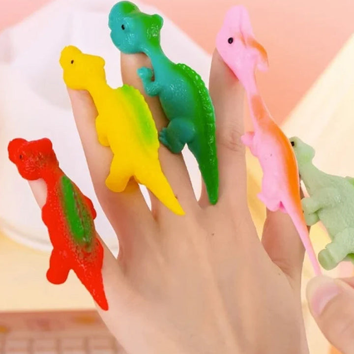 "Set om 10 fingerleksaker med dinosaurieslungor i färgglada mönster, perfekt för barn att leka och lära sig om dinosaurier."