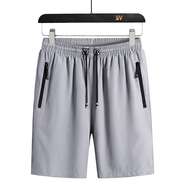 "Snabbtorkande herrshorts för stranden med sportlinjeformad design, fantastisk elasticitet och ventilerande material."