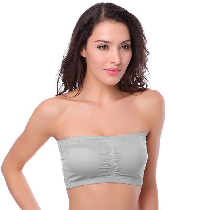 "Sömlös bandeau BH för damer, beige nylon och bomullsblandning, avtagbart skumfoder, breda sidovingar för komfort och stöd."